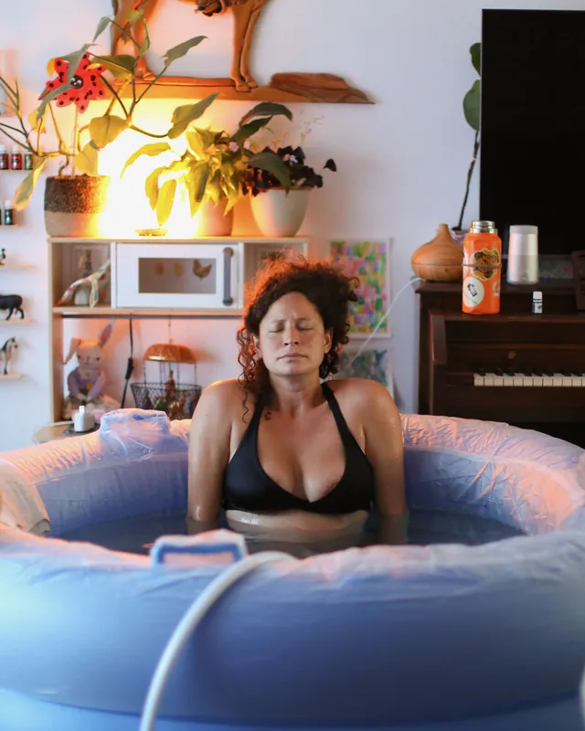 A mother laboring calmly in a birth pool at home, Orange County birth photography by Jenn Miller