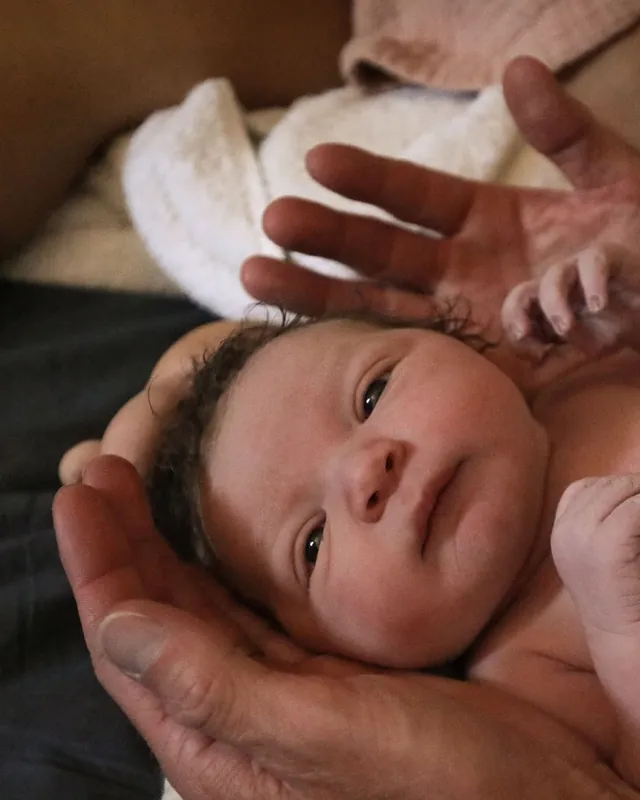 A newborn, wide awake in the first hour after birth, Orange County birth photography by Jenn Miller