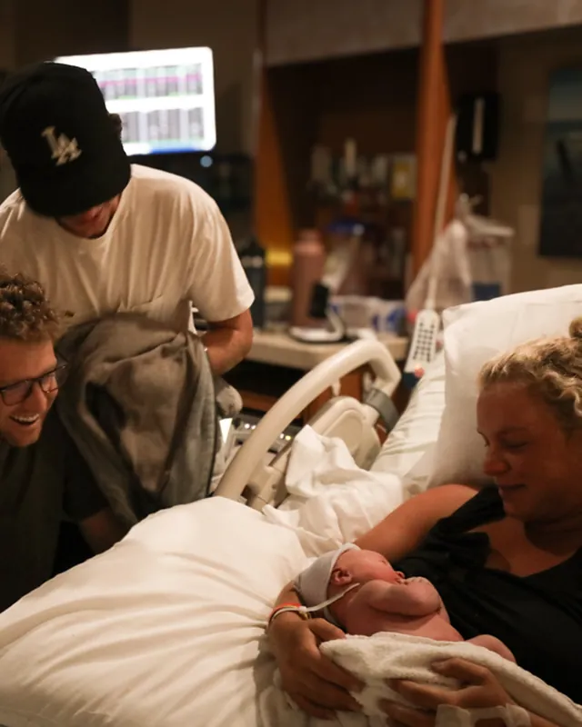 A family celebrates the first minutes with their newborn, Orange County birth photography by Jenn Miller