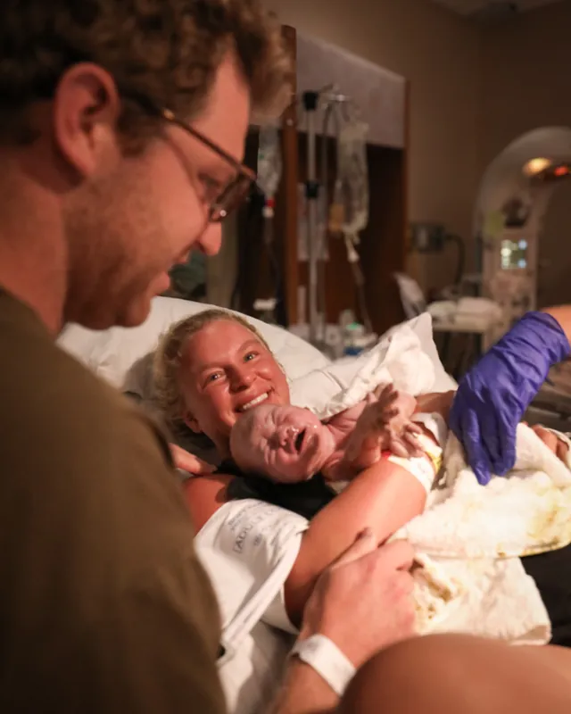 A mother overjoyed as she meets her newborn, Orange County birth photography by Jenn Miller
