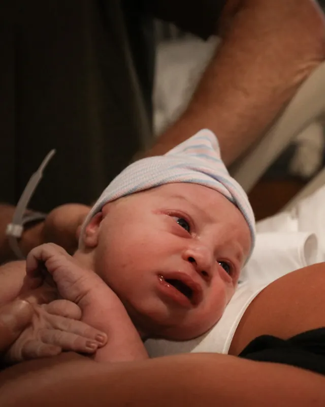 A newborn in the first minutes after birth, Orange County birth photography by Jenn Miller